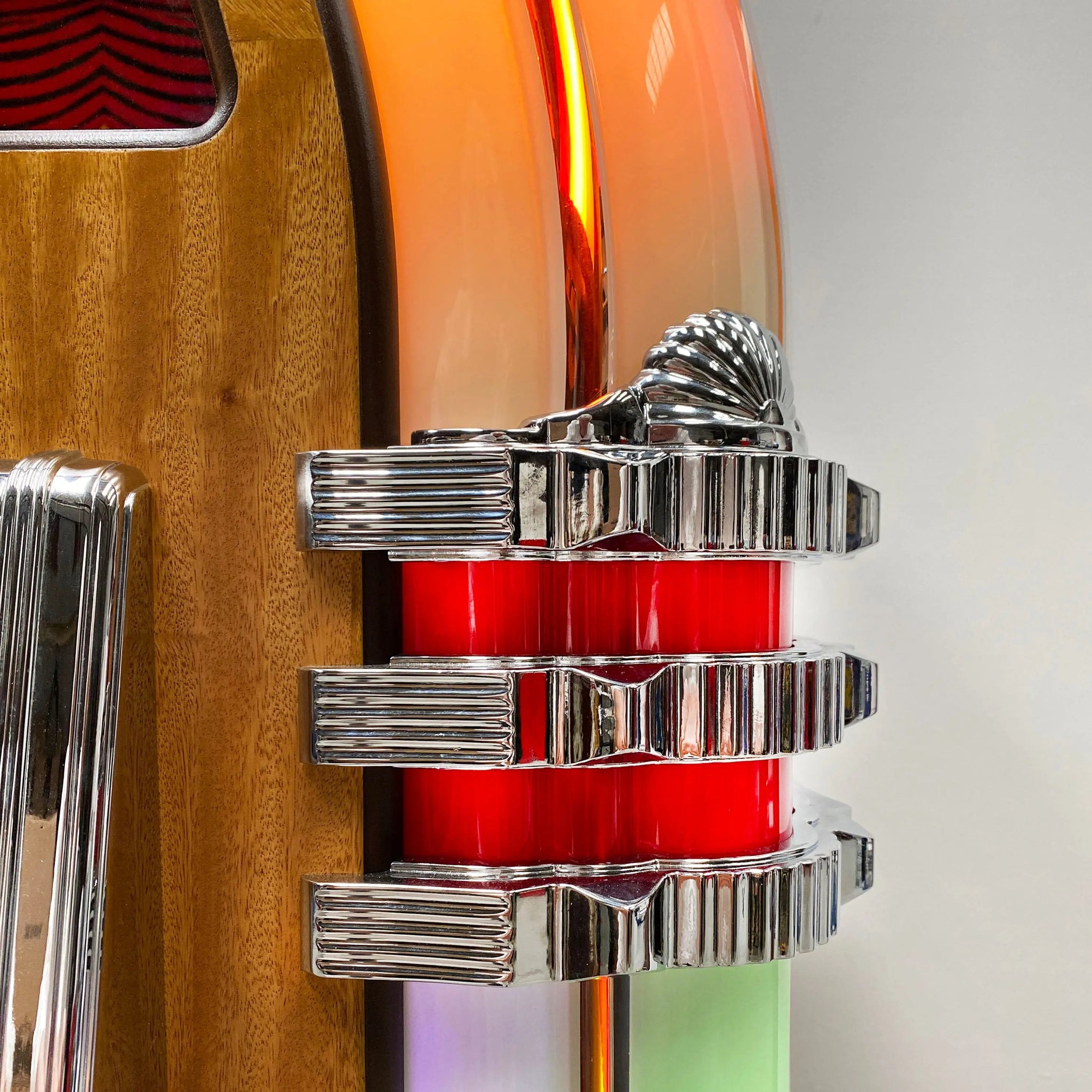 Detailed images of the side castings & Mirror tiles on a Rock-Ola Bubbler Vinyl 45 Deluxe Jukebox